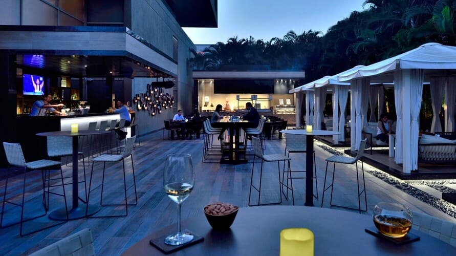 Luxury hotel restaurant in Hinjewadi with buffet setup and fine dining ambiance for business dinners.